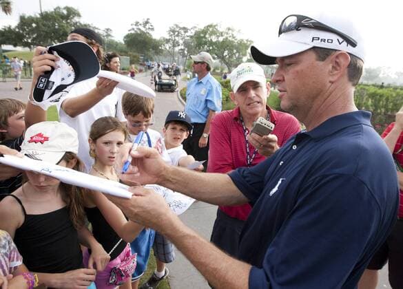 Davis Love lll (USA) signs autographs after finishing at three under par in the first round of The Players Championship PGA golf tournament in Ponte Vedra Beach -  PVB2010050616