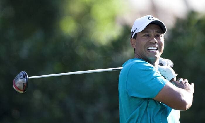 Tiger Woods (USA) grimaces after hitting his tee shot into the gallery on hole number eleven during the second round of The Players Championship PGA golf tournament in Ponte Vedra Beach, Florida May 7, 2010. Woods finished his second at three under par.  PVB2010050709