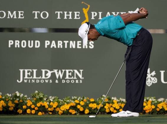 Tiger Woods (USA) streatches prior to starting his second round of The Players Championship PGA golf tournament in Ponte Vedra Beach, Florida May 7, 2010. Woods ended the day at two under par.  PVB2010050708 o00 Sponsor Wirtschaft Jeld Wen proud Partners