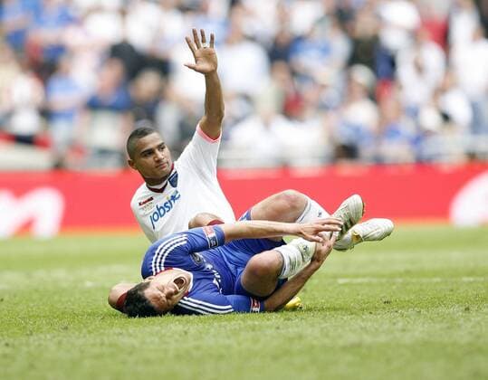 Chelsea s Michael Ballack (R) gets injured by Portsmouth s Kevin Prince Boateng EON FA Cup Final Chelsea FC v Portsmouth FC 15th May, 2010 EDITORIAL USE ONLY. No use with unauthorised audio, video, data, fixture lists, club league logos or live services. Online in-match use limited to 120 images, no video emulation. No use in betting, games or single club league player publications.