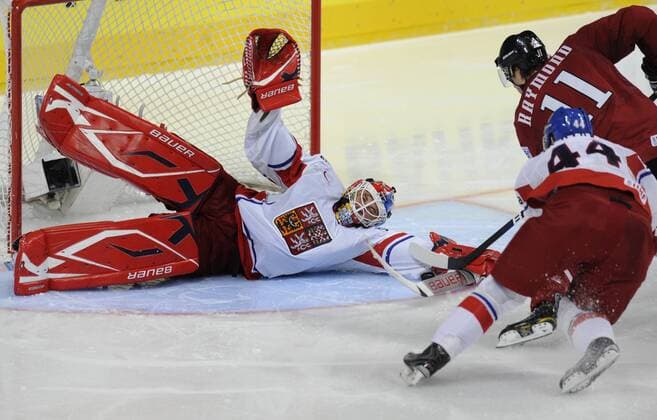 Czech icehockey goalie Tomas Vokoun (L) with Mason Raymond of Canada during World Cup game in Group F, Mannheim, Germany, May 18, 2010. (CTKxPhoto RadekxPetrasek)  CTKPhoto5201005180849701