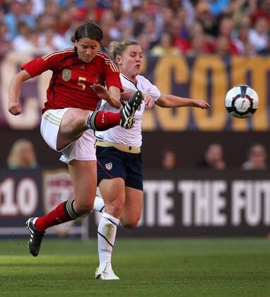 22 MAY 2010: Germany s Annike Krahn (L) kicks the ball away from USA s Amy Rodriguez during the first half of their International Friendly match at Cleveland Browns Stadium in Cleveland Ohio May 22, 2010. Icon22762132 o00 DFB EDITORIAL USE ONLY