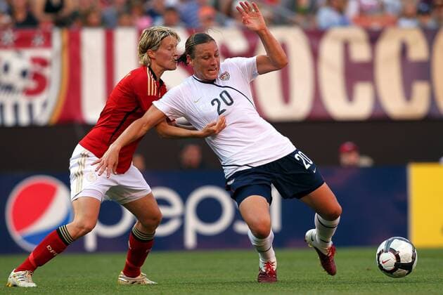 22 MAY 2010: USA team member Abby Wambach (20) is pulled down by Germany s Saskia Bartusiak during the first half of their International Friendly match at Cleveland Browns Stadium in Cleveland Ohio May 22, 2010. Icon22762140 o00 DFB EDITORIAL USE ONLY