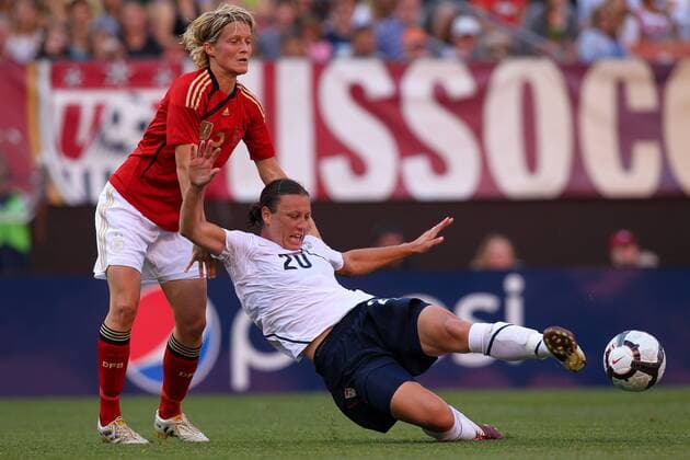 22 MAY 2010: USA team member Abby Wambach (20) is pulled down by Germany s Saskia Bartusiak during the first half of their International Friendly match at Cleveland Browns Stadium in Cleveland Ohio May 22, 2010. Icon22762141 o00 DFB EDITORIAL USE ONLY