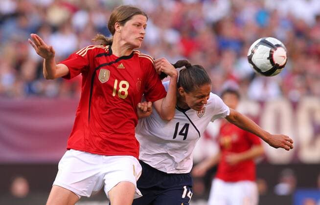 22 MAY 2010: USA team Stephanie Cox (14) heads the ball away from Germany s Kerstin Garefrekes during the second half of their International Friendly match at Cleveland Browns Stadium in Cleveland Ohio May 22, 2010. Icon22762145 o00 DFB EDITORIAL USE ONLY