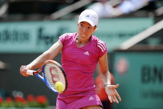 PARIS, - Belgium s Justine Henin hits a return during their women s singles first round match at the French Open tennis tournament at Roland Garros, Paris, capital of France, May 25, 2010. Henin won 2-0. (3) 