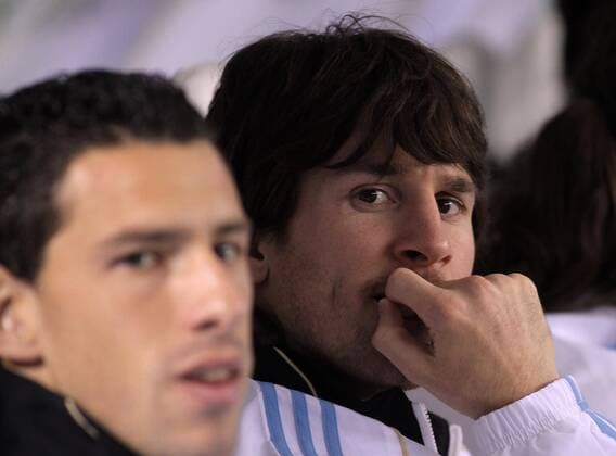 BUENOS AIRES, - Argentina s Lionel Messi (R) and Maxi Rodriguez sit on the bench during their friendly match against Canada held in Buenos Aires, Argentina, May 24, 2010. (9) 