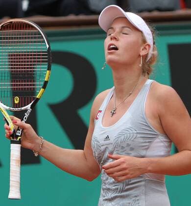 Caroline Wozniacki of Denmark reacts after a shot during her French Open quarterfinal match at Roland Garros in Paris on June 1, 2010.  PAR20100601707