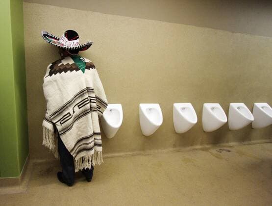 A Mexican fan goes to the toilet FIFA World Cup 2010 Group A v Mexico 11th June, 2010 EDITORIAL USE ONLY. No use with unauthorised audio, video, data, fixture lists, club league logos or live services. Online in-match use limited to 120 images, no video emulation. No use in betting, games or single club league player publications. o0 kurios Komik Fan Zuschauer WC Toilette Urinal