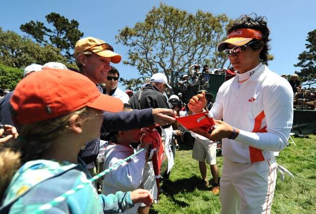 Ryo Ishikawa of Japan signs autographs during a practice round prior to the 2010 U.S. Open at the Pebble Beach, California, on June 16, 2010.  SFP20100616311