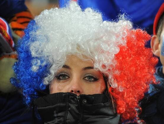 A French football fan brings the glamour FIFA World Cup 2010 Group A France EDITORIAL USE ONLY. No use with unauthorised audio, video, data, fixture lists, club league logos or live services. Online in-match use limited to 120 images, no video emulation. No use in betting, games or single club league player publications. o0 weiblich Frau Perücke Landesfarben