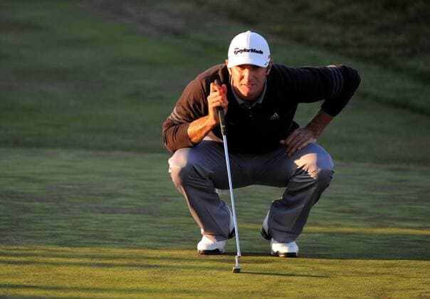 Dustin Johnson (USA) lines up a putt on the 17th green during the third round of the U.S. Open in Pebble Beach, California on June 19, 2010.  PBP20100619320