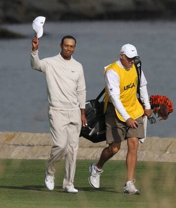 Tiger Woods (USA) doffs his hat to the fans on the 18th green on the day three of the U.S. Open in Pebble Beach, California on June 19, 2010.  PBP2010061921