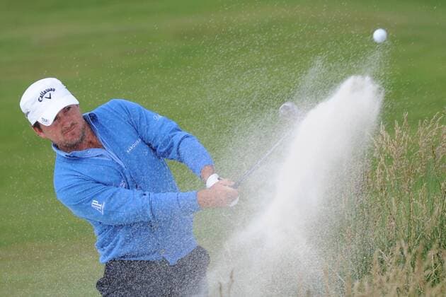 Graeme McDowell (Northern Ireland) hits out of a bunker on the 6th fairway during the third round of the U.S. Open in Pebble Beach, California on June 19, 2010.  PBP20100619310