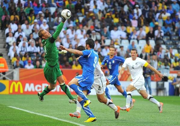 Goalkeeper Mark Paston of New Zealand saves as Vincenzo Iaquinta of Italy closes in FIFA World Cup 2010 Group F Italy (ITA blue) vs New Zealand (NZL white) 20th June, 2010 EDITORIAL USE ONLY. No use with unauthorised audio, video, data, fixture lists, club league logos or live services. Online in-match use limited to 120 images, no video emulation. No use in betting, games or single club league player publications. o0 Abwehr