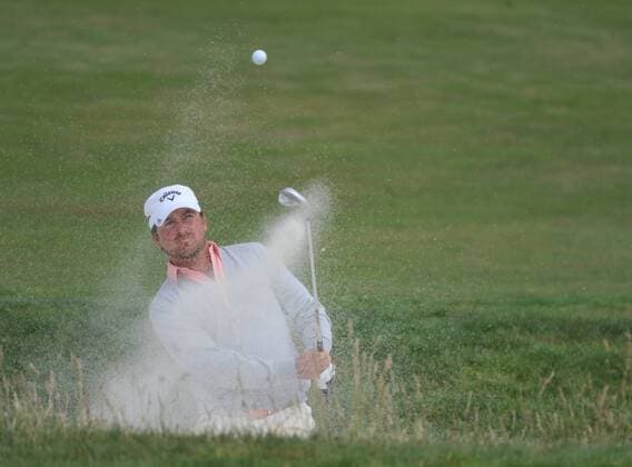 Graeme McDowell of Northern Ireland hits out of a bunker on the 12th hole on day four of the U.S. Open in Pebble Beach, California on June 20, 2010. McDowell won the US Open by shooting par.  PBP2010062032 o0 PGA Tour, Mc Dowell