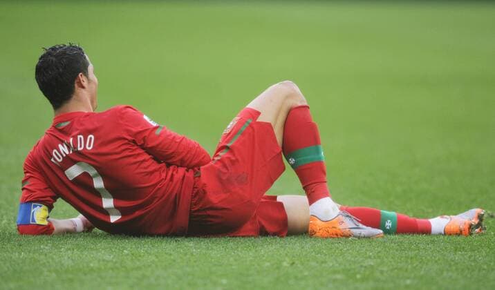 Cristiano Ronaldo of Portugal lies on the field during the 2010 World Cup group G soccer match against Democratic People s Republic of Korea (DPRK) at Green Point stadium in Cape Town 