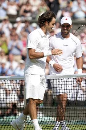 June 21st 2010: Wimbledon International Tennis Tournament held at the All England Lawn Tennis Club, London, England. Roger Federer of SUI l. and Alejandro Falla COL . xNickxTapsell Actionplusx  ActionPlus53880 Content restricted for UK based newspaper