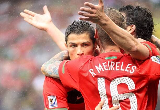 Christiano Ronaldo (L) Portugal soccer players celebrate scoring another goal Portugal (red) vs. North Korea (white) 7:0 Gallo201001 o0 Jubel, Freude