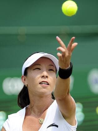 Zheng Jie of China serves during the women s singles first round match at the 2010 Wimbledon tennis championships in London - 