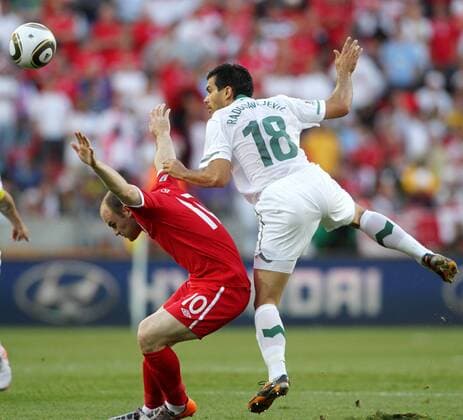(100623) -- PORT ELIZABETH, June 23, 2010 () -- Wayne Rooney (L) of England vies with Slovenia s Aleksandar Radosavljevic during the 2010 World Cup Group C soccer match at Nelson Mandela Bay stadium in Port Elizabeth, June 23, 2010. - 