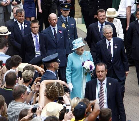 Tennis - The Wimbledon Championships Queen Elizabeth II and Prince Philipp (center behind her) visiting Wimbledon at the All England Lawn Tennis and Croquet Club 