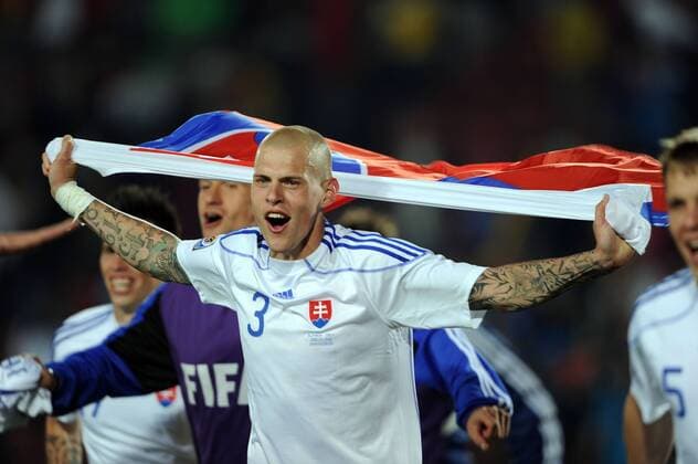 Italy v Slovakia 24 06 2010 Martin Skrtel (Slovakia) celebrates withy the National flag at the end of the match.  o0 Jubel Freude Fahne, Nationalfahne