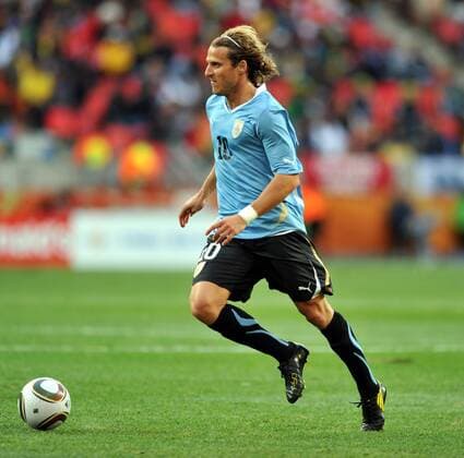 Diego Forlan of Uruguay breaks through during the 2010 World Cup round of 16 soccer match against South Korea at Nelson Mandela Bay stadium in Port Elizabeth, on June 26, 2010. 