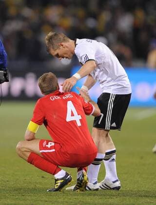 Bastian Schweinsteiger of Germany (R) consoles a devasted Steven Gerrard of England FIFA World Cup 2010 Round of 16 Germany v England 27th June, 2010 EDITORIAL USE ONLY. No use with unauthorised audio, video, data, fixture lists, club league logos or live services. Online in-match use limited to 120 images, no video emulation. No use in betting, games or single club league player publications. o0 Enttäuschung