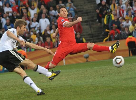 Frank Lampard (R) of England tries to block the shot by Thomas Müller of Germany during the match between England and Germany at the 2010 FIFA World Cup at Free State stadium in Bloemfontein on June 27, 2010. Germany won 4-1 and is qualified for the quarterfinals. 