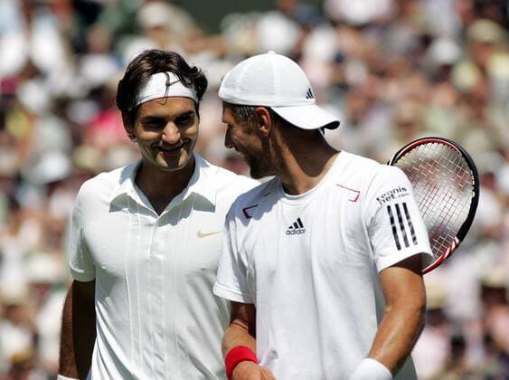TENNIS - ATP, Wimbledon 2010 LONDON,28.JUN.10 - TENNIS - ATP World Tour, Wimbledon 2010, Grand Slam. Bild zeigt Roger Federer (SUI) und Juergen Melzer (AUT, R). 