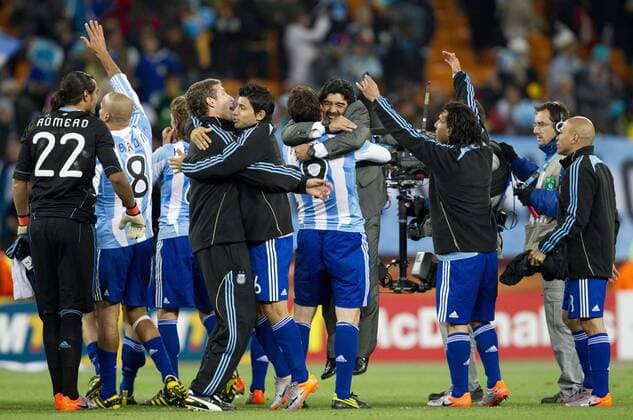 Coach Diego Armando Maradona (ARG) (C) with Gonzalo Higuain and other players of Argentina celebrate after the 2010 FIFA World Cup Round of Sixteen match between Argentina (blue) and Mexico (green) 3-1 at Soccer City Stadium on June 27, 2010 in Johannesburg. ---  o0 Jubel Freude Totale Nationaltrainer