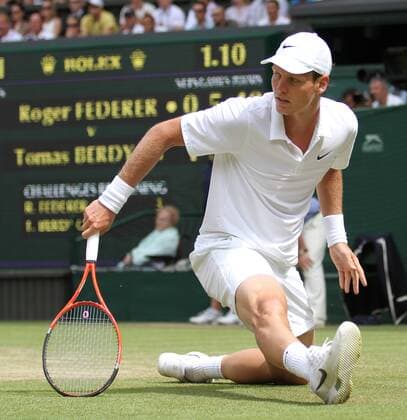 Czech Tomas Berdych does the splits in his Quarter-Final match at the Wimbledon championships in Wimbledon on June 30, 2010..  LON2010063007