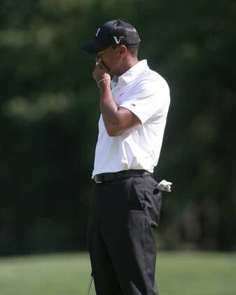 Tiger Woods (USA) holds his head in rejection after missing his putt on the 14th green during the first round of the AT&T National at Aronimink Golf Club in Newtown Square, Pennsylvania. Icon20810070163 EDITORIAL USE ONLY