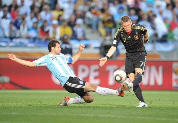 Argentina s Javier Mascherano (L) defends Bastian Schweinsteiger of Germany during the 2010 World Cup quarterfinal soccer match at Green Point stadium in Cape Town on July 3, 2010. 