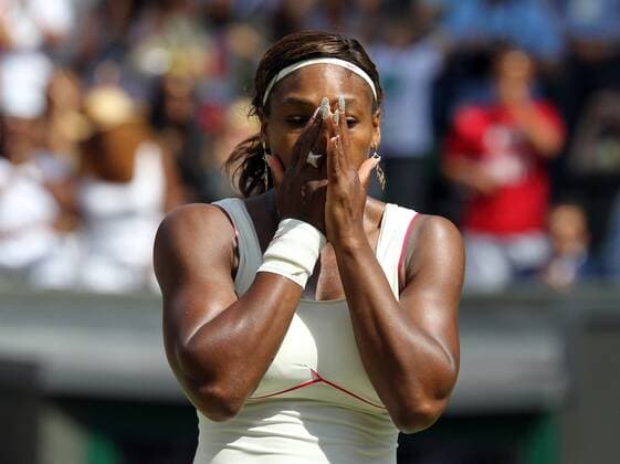 Tennis - The Wimbledon Championships - Serena Williams ( USA ) Celebrates her win at the All England Lawn Tennis and Croquet Club 