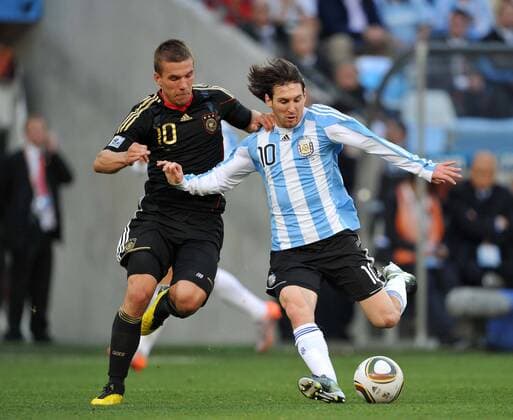 Lukas Podolski (L) of Germany vies with Lionel Messi of Argentina during their 2010 World Cup quarterfinal soccer match at Green Point stadium in Cape Town on July 3, 2010.  o0 Aufmacher