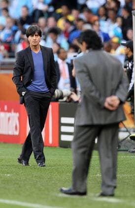 Argentina s coach Diego Armando Maradona (R) is watched by Germany s coach Joachim Löw FIFA World Cup 2010 QuarterFinals Argentina v Germany 3rd July, 2010 EDITORIAL USE ONLY. No use with unauthorised audio, video, data, fixture lists, club league logos or live services. Online in-match use limited to 120 images, no video emulation. No use in betting, games or single club league player publications.