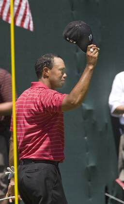 Tiger Woods (USA) doffs his hat to the gallery following the final round play of the AT and T National at Aronimink Golf Club in Newtown Square, Pennsylvania on July 4, 2010. Tiger finished with a one over par 71.  PHI2010070404