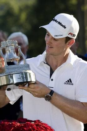 Justin Rose (England) admires the AT and T National trophy on the 18th hole after winning the National at Aronimink Golf Club in Newtown Square, Pa. July 4, 2010. Rose finished with a par 70 for the day to win the tournament with a 10 under par 270.  PHI2010070414 o0 Jubel, Freude,