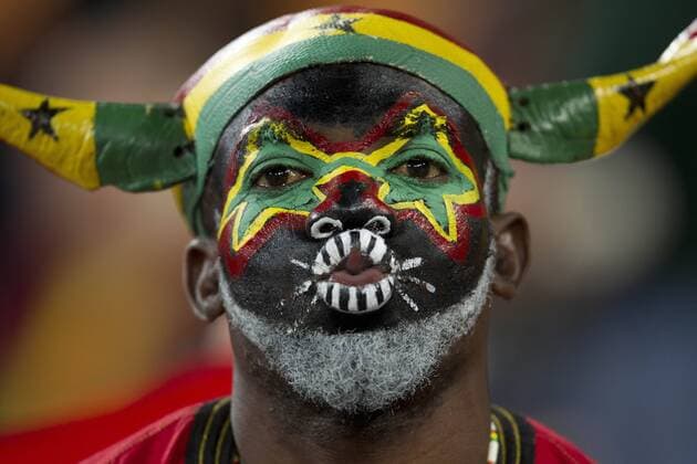 Fan of Ghana prior to the 2010 FIFA World Cup QuarterFinals football match on July 02, 2010 at Soccer City Stadium in Soweto, suburb of Johannesburg. .  o0 Gesichtsbemalung, Bemalung Nationalfarben kurios Komik