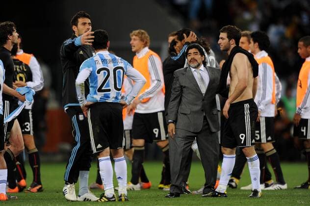 Diego Maradona 2.r. head coach and Gonzalo Higuain r. of Argentina look dejected after the 2010 FIFA World Cup QuarterFinal match between Argentina 0-4 Germany at Green Point Stadium in Cape Town.  (002666) o0 Nationaltrainer