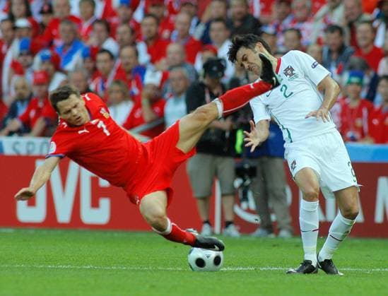 GENEVA, Portugal s Paulo Ferreira (R) fights for the ball against Czechia s Libor Sionko during their Euro 2008 Group A match.  612206