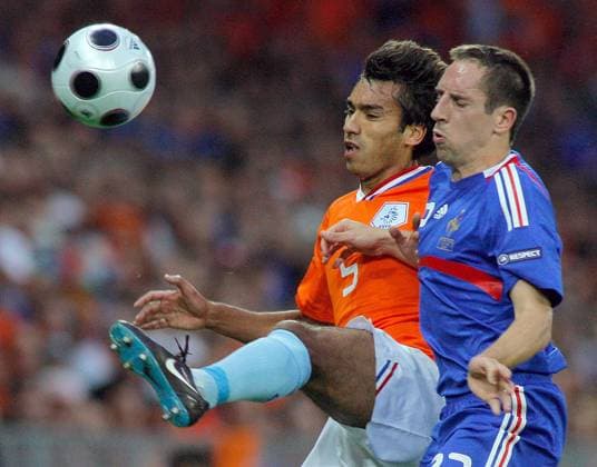 BERNE, Netherlands Giovanni van Bronckhorst (orange) and France s Franc Ribery (blue) fight for the ball during the match. Netherlands beat France 4-1 to advance to the quarterfinals of Euro 2008.  612315