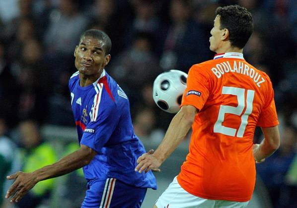 BERNE, Netherlands Khalid Boulahrouz (orange) and France s Florent Malouda (blue) fight for the ball during the match. Netherlands beat France 4-1 to advance to the quarterfinals of Euro 2008.  612316