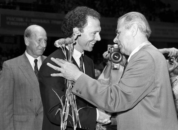 Moscow. Celebration of the 60th anniversary of Lev Yashin at Dynamo Stadium. Lev Yashin (UDSSR, R) receives congratulations from Franz Beckenbauer (GER) -  1148744