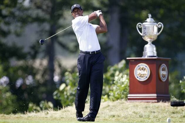 Tiger Woods (USA) follows through on his tee shot on the first hole during the first round of the 92nd PGA Championship at Whistling Straits in Kohler, Wisconsin on August 12, 2010. Woods finished his round with a 1-under-par 71.  BKX2010081203 o0 Pokal Trophäe Objekte