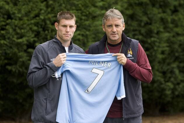 Football - Manchester City - : James Milner and coach Roberto Mancini pose for photographs at the Carrington training complex, Manchester 