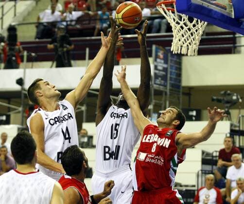 2010 FIBA World Championship GROUP D match between Canada and Lebanon at Halkapinar Dome Arena, Izmir. 28 August 2010. Pictured: Levon Kendall (L) and Joel Anthony ( center) of Canada and Elie Rustom (R) of Lebanon. 