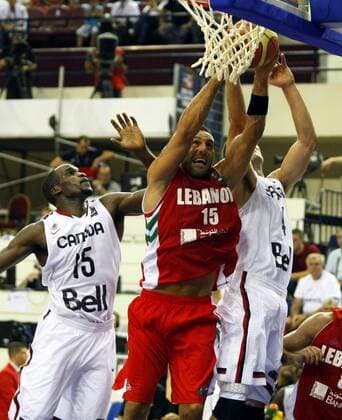 2010 FIBA World Championship GROUP D match between Canada and Lebanon at Halkapinar Dome Arena, Izmir. 28 August 2010. Pictured: Fadi El Khatib ( center) of Lebanon and Joel Anthony (L) and Jermaine Anderson (R) of Canada. 